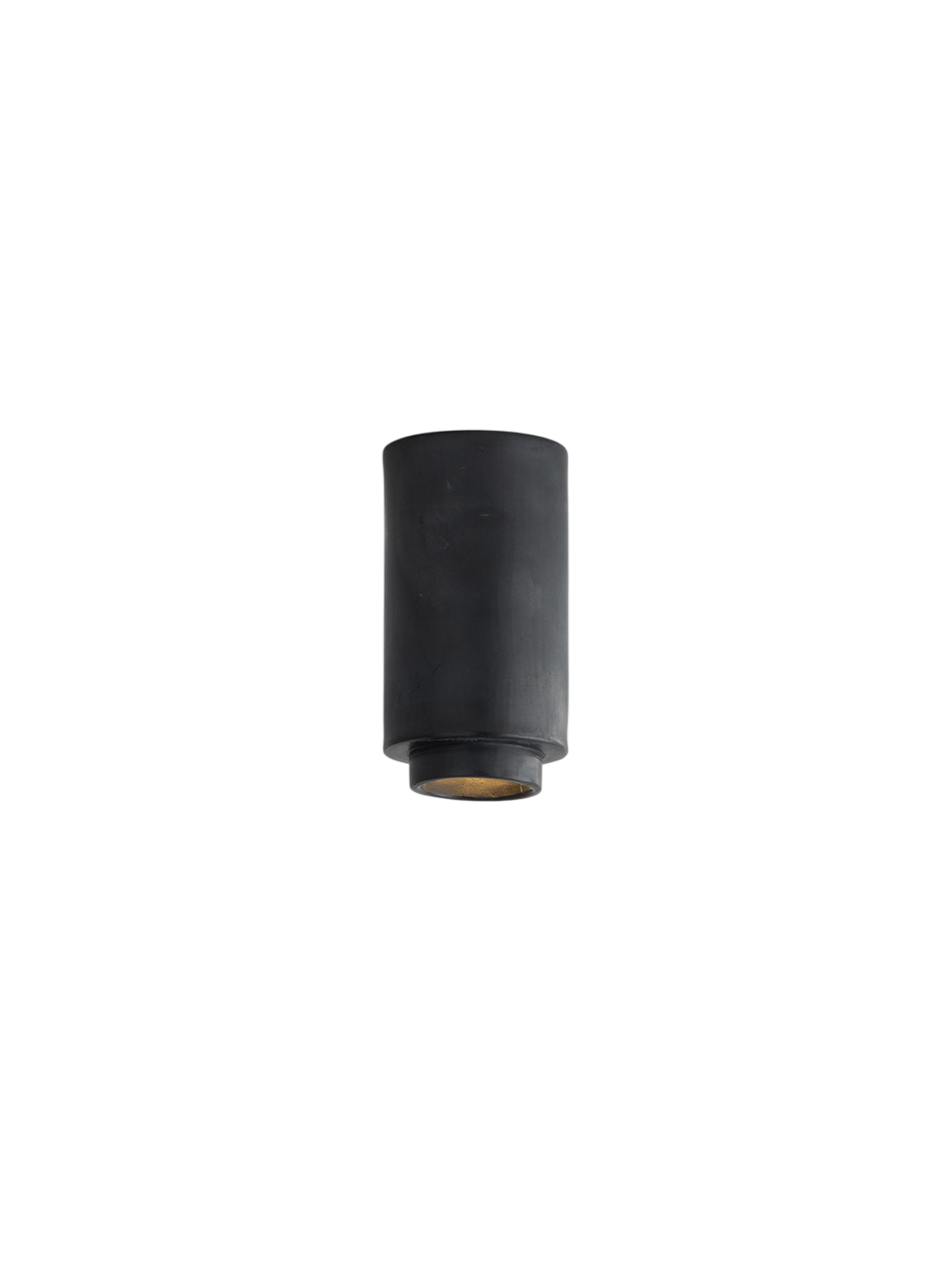 A close-up of a sleek black cylindrical pendant light, showing the minimalist design with a soft golden light source at the bottom.