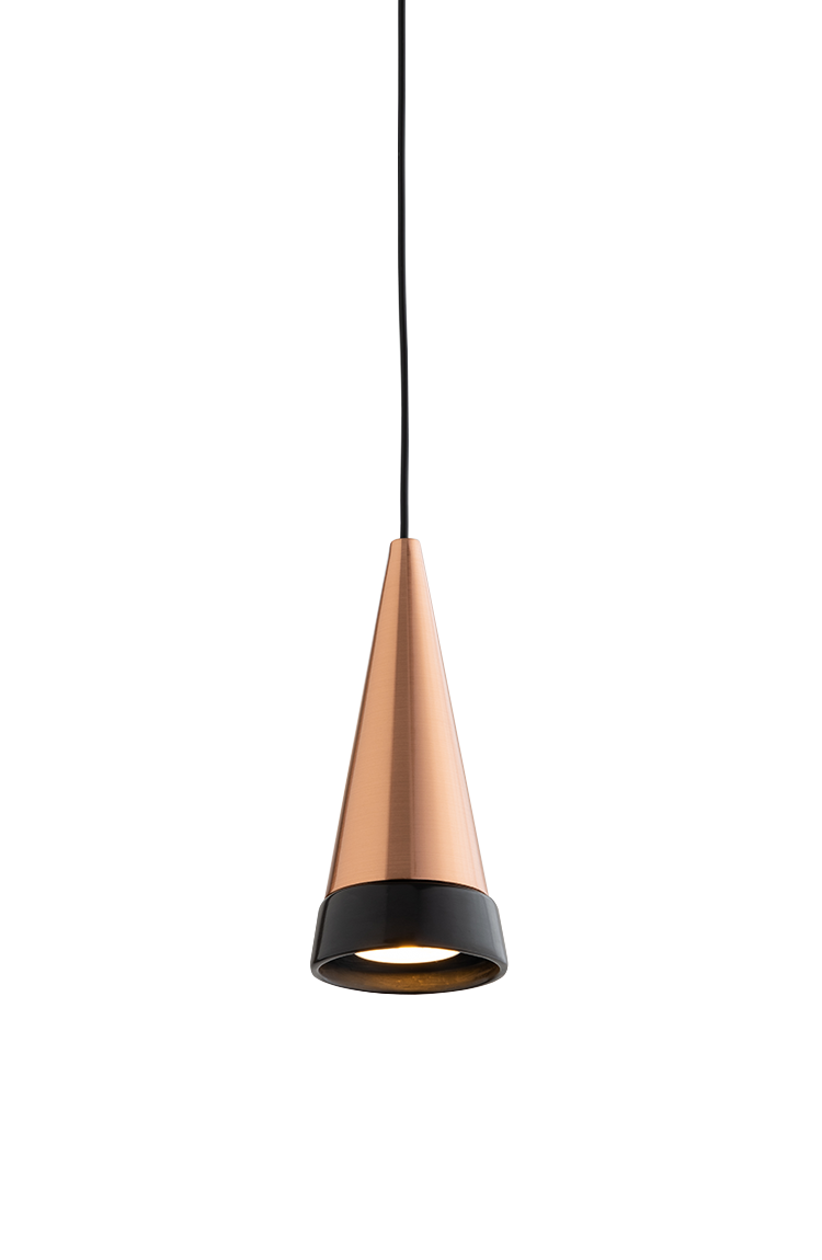 A pendant light with a transparent glass body and black base, lit from within, casting a gentle glow.