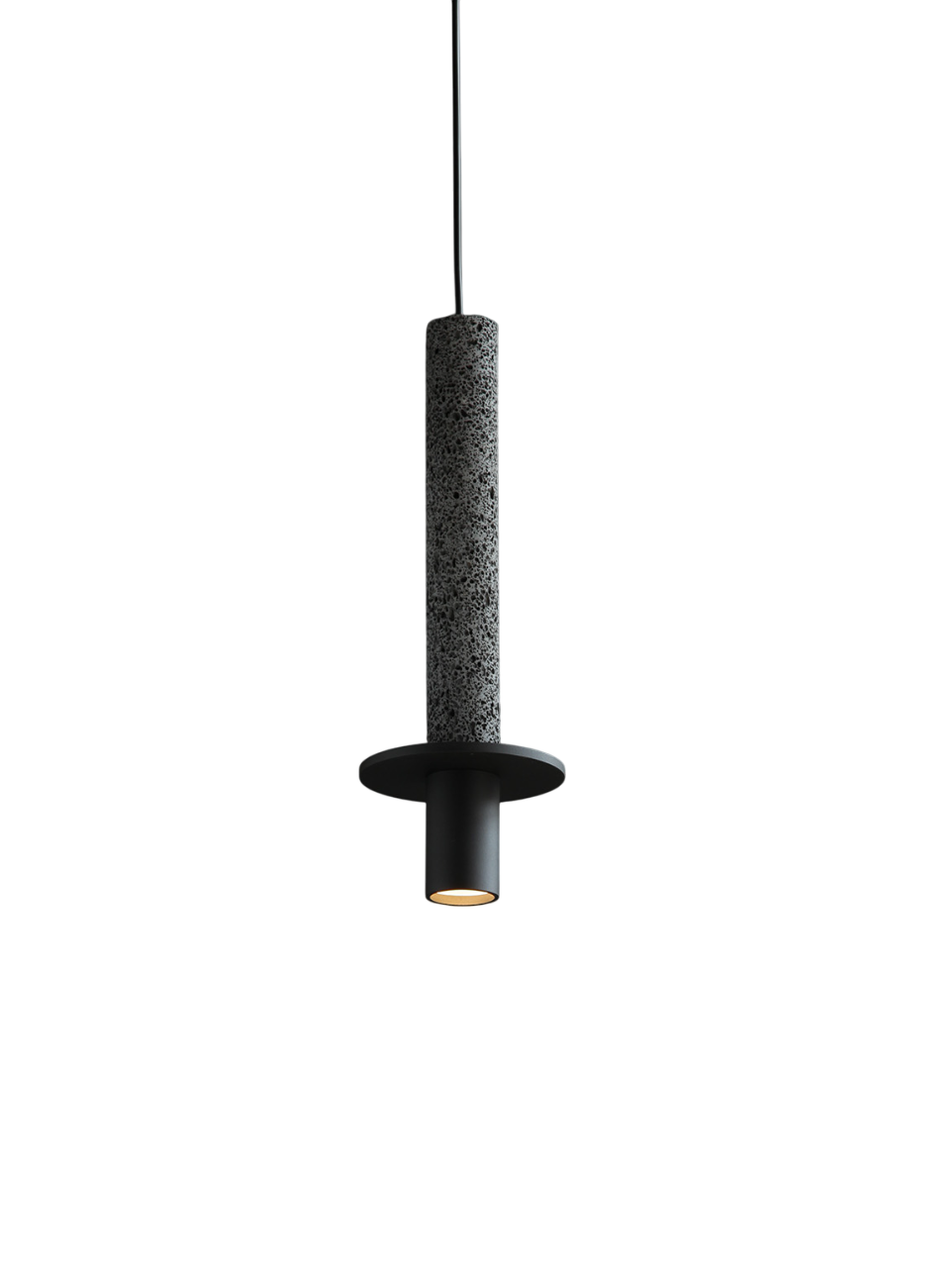A pendant light with a black stone-like body and a matte black metal base, emitting focused light.