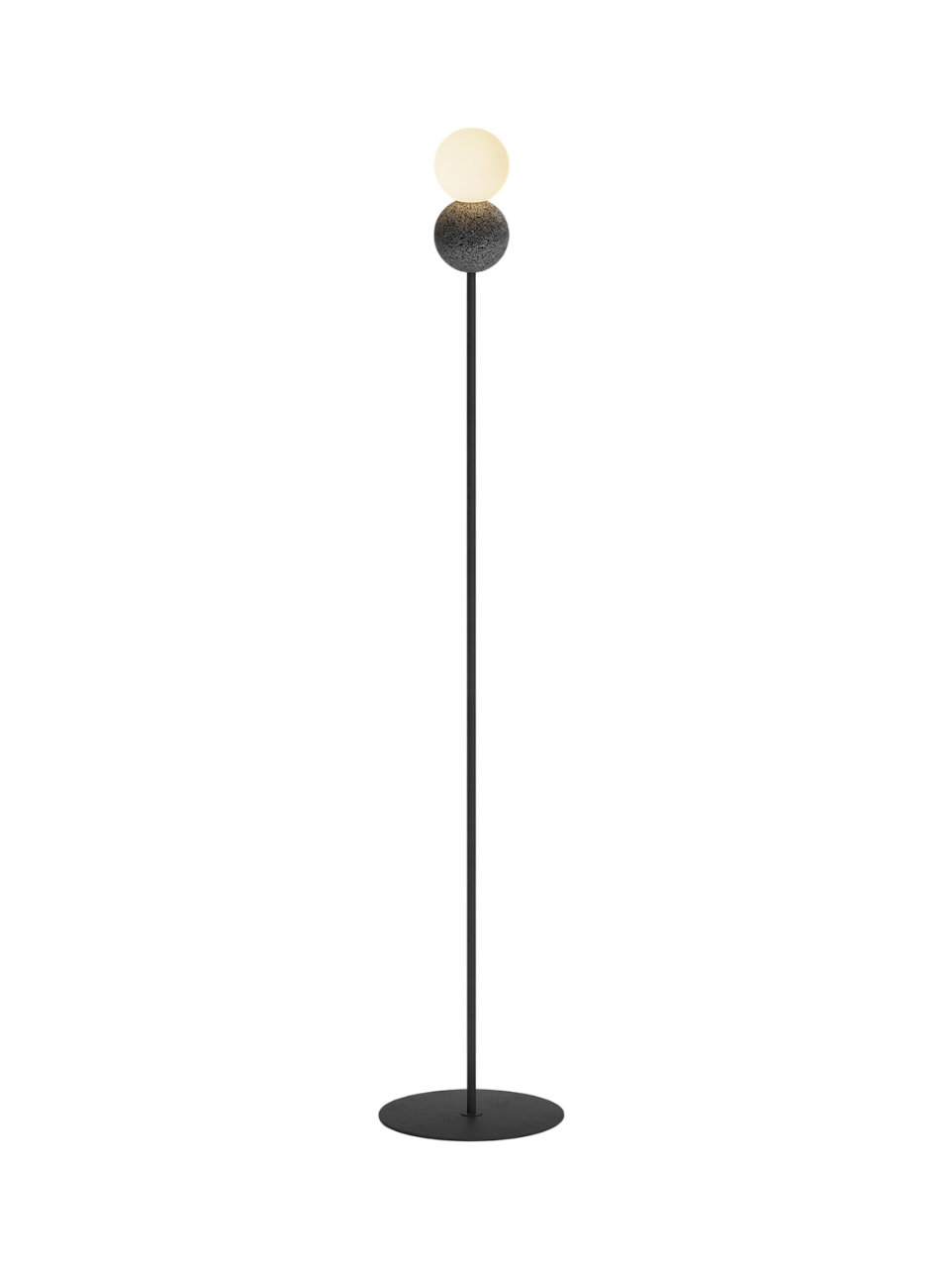 Origo Floor Lamp illuminated, highlighting its volcanic stone base and glowing glass sphere.