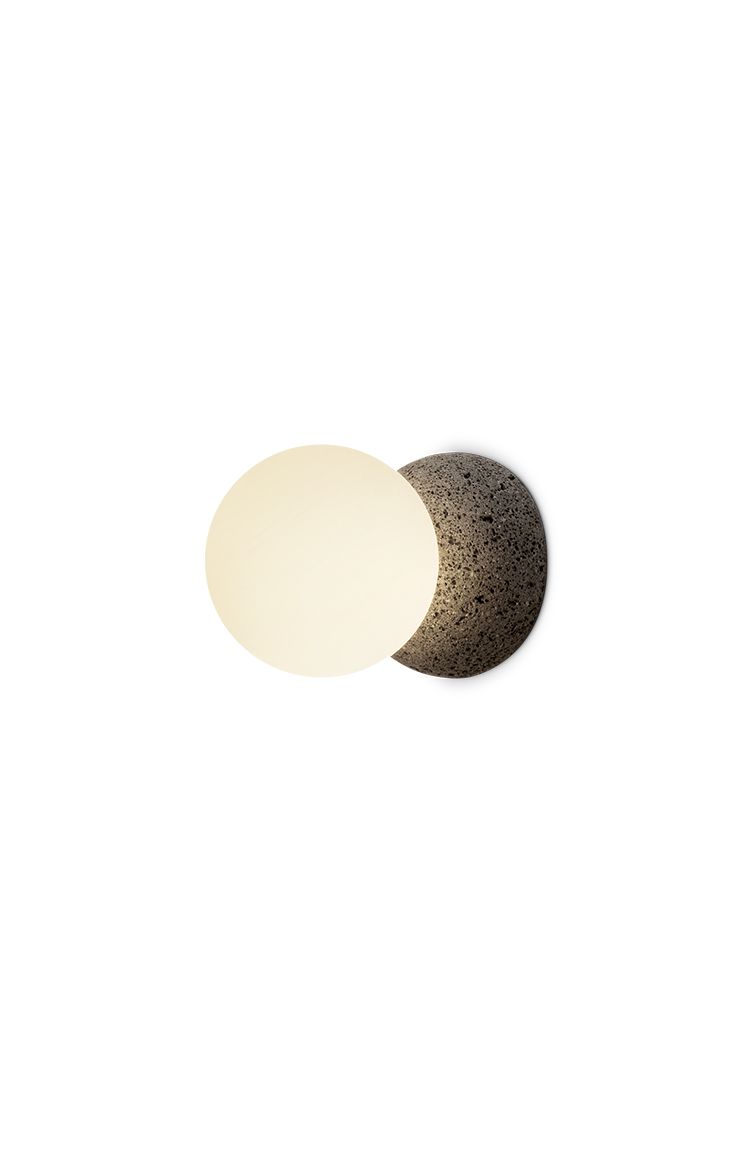 Studio render of the Origo wall lamp with stone-textured base and glowing sphere.