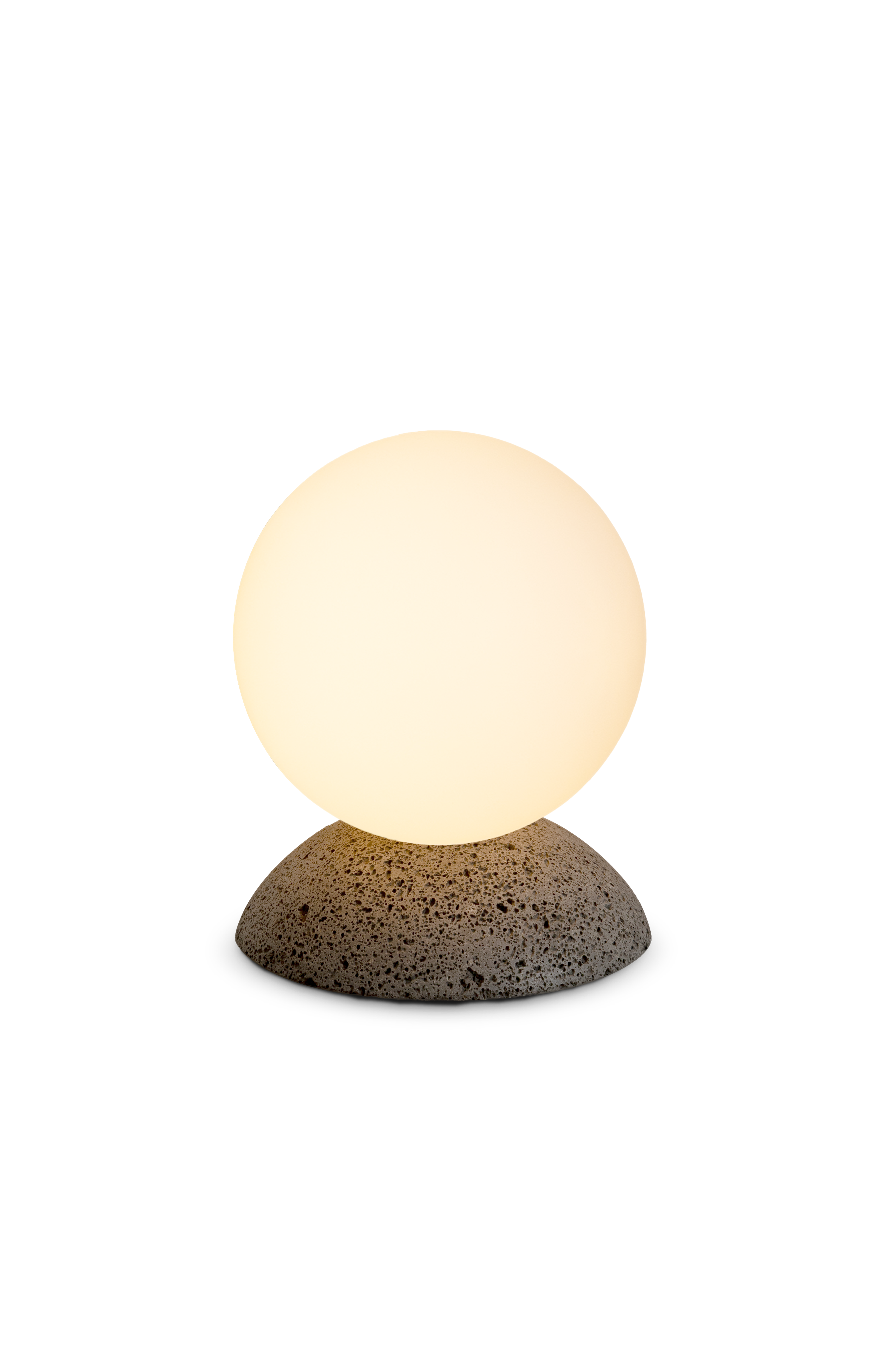 Small lamp with a round glass shade and textured base on a white background
