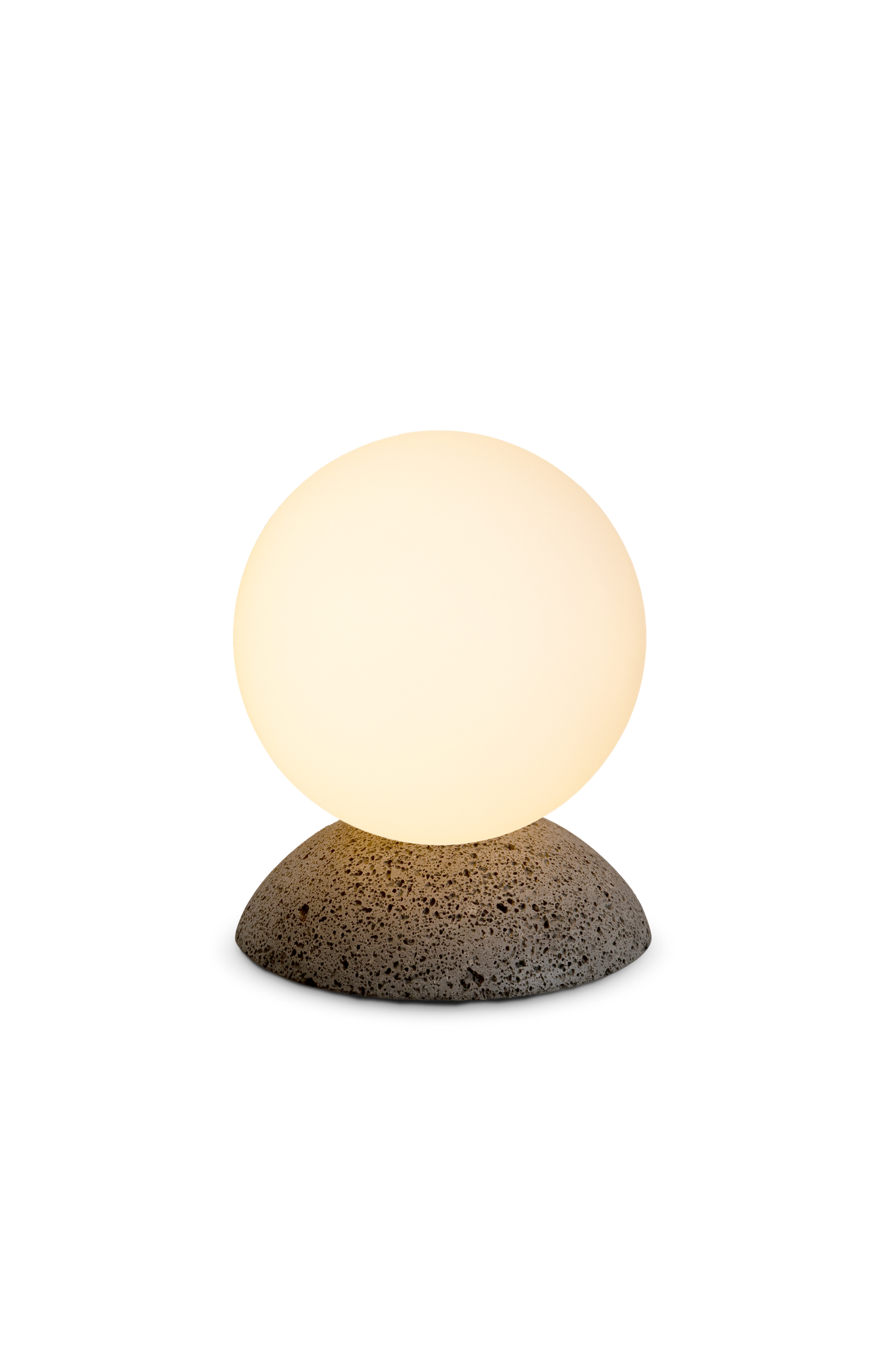 Small lamp with a round glass shade and textured base on a white background