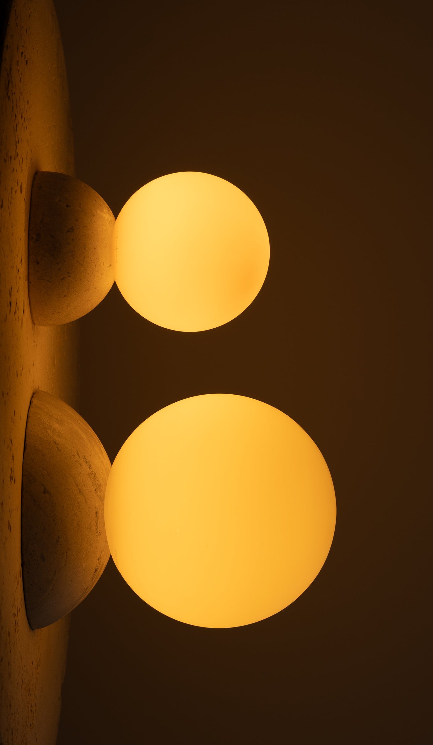 Two glowing yellow lights on a dark background