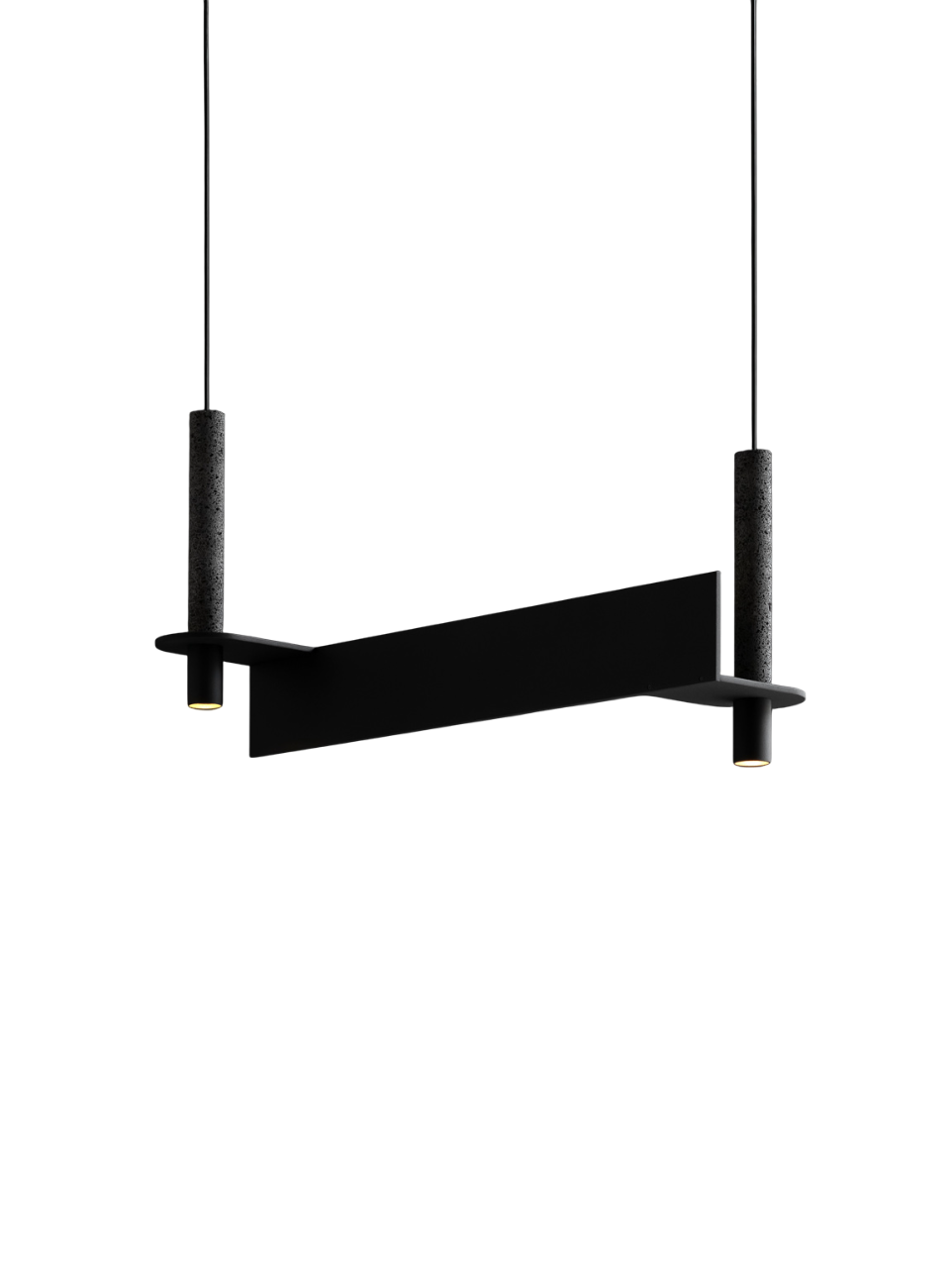 Minimalist black pendant light with two cylindrical stone-like supports and slim downlights at each end.