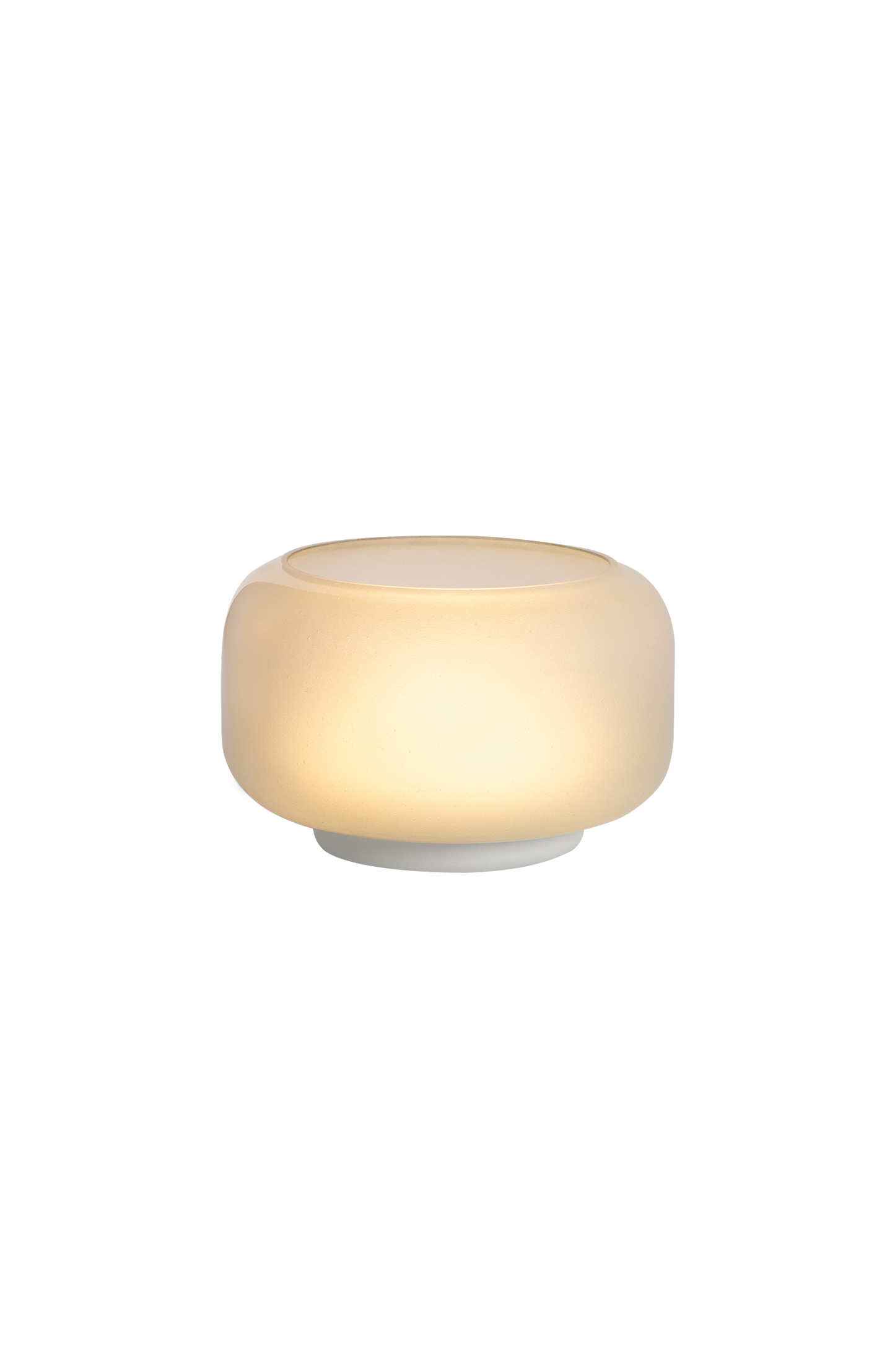 A frosted white glass table lamp with a rounded shape emitting warm light.